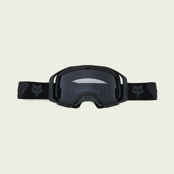 dark goggles on green background